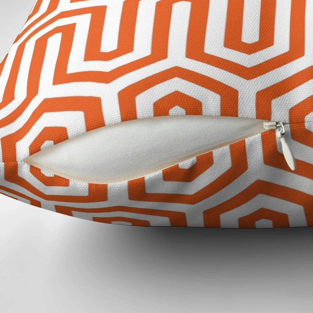 Coral orange pillow with an elegant Egyptian-inspired geometric pattern, perfect for 1920s and 1930s inspired home decor.