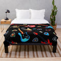 Plush blanket featuring a vibrant electric guitar design