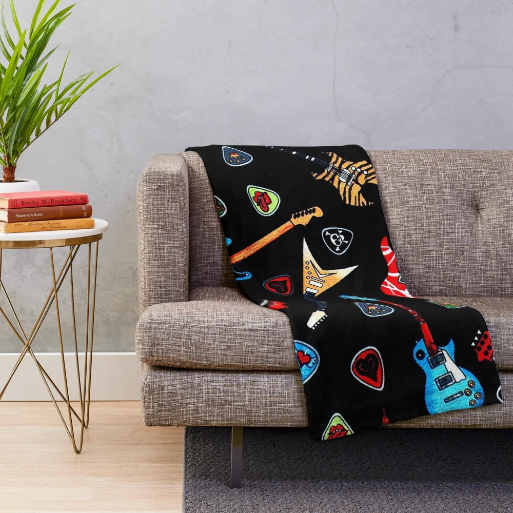 Plush blanket featuring a vibrant electric guitar design