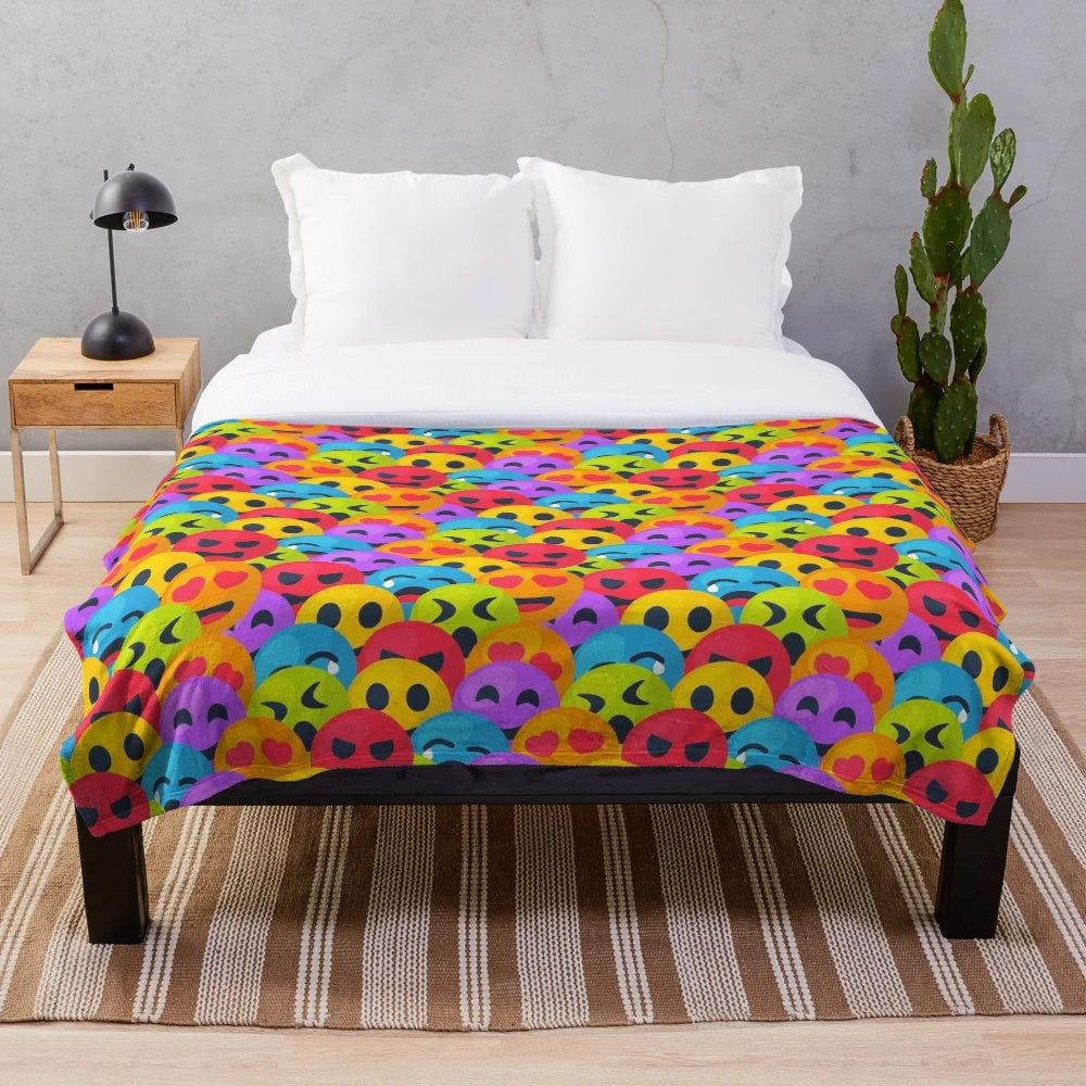 Colorful plush blanket with various emoji designs