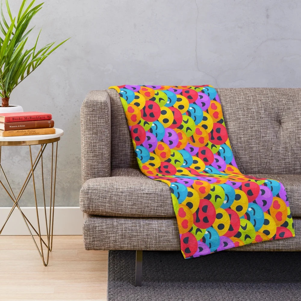 Colorful plush blanket with various emoji designs