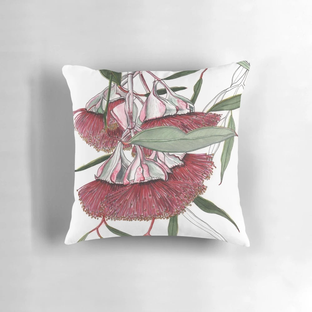 Closeup image of stunning pink eucalyptus mallee flowers on a decorative pillow.