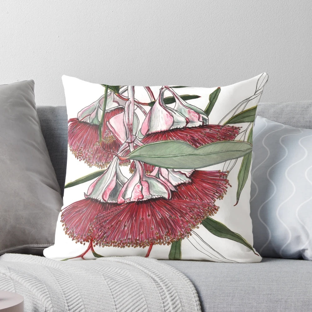 Closeup image of stunning pink eucalyptus mallee flowers on a decorative pillow.