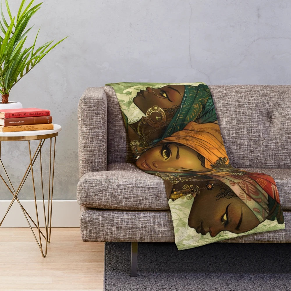 Colorful plush blanket featuring fairy sisters from West African folklore