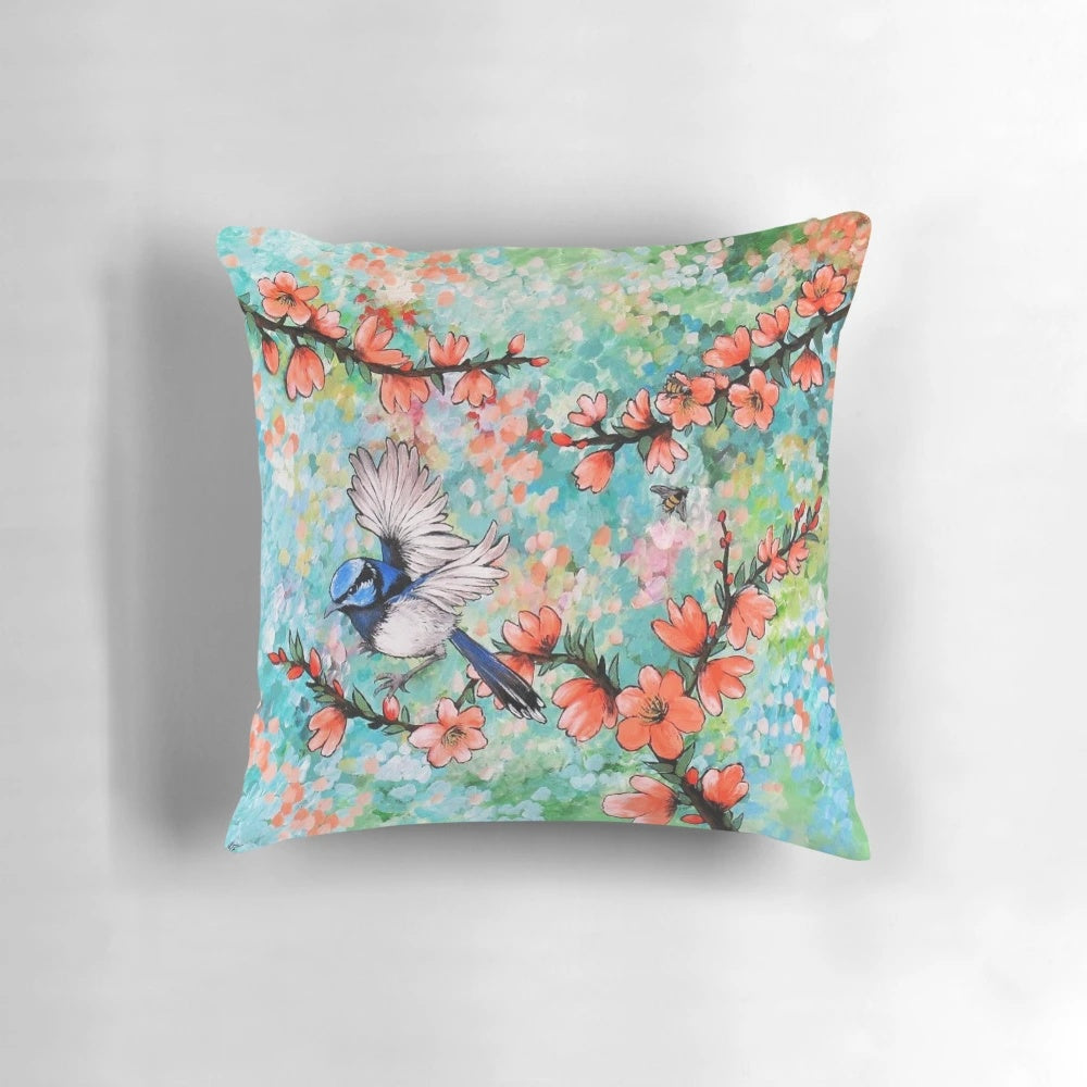 Colorful throw pillow featuring a detailed illustration of a vibrant fairy wren bird against a nature-inspired background.
