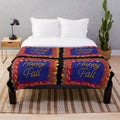 Colorful fall leaves plush blanket with a green, blue, and black background