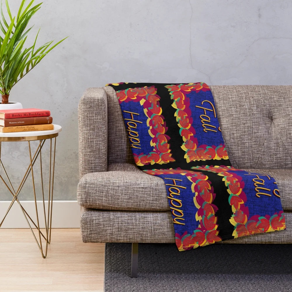 Colorful fall leaves plush blanket with a green, blue, and black background