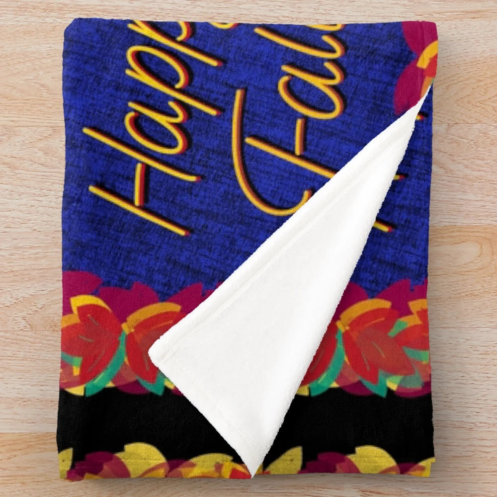 Colorful fall leaves plush blanket with a green, blue, and black background