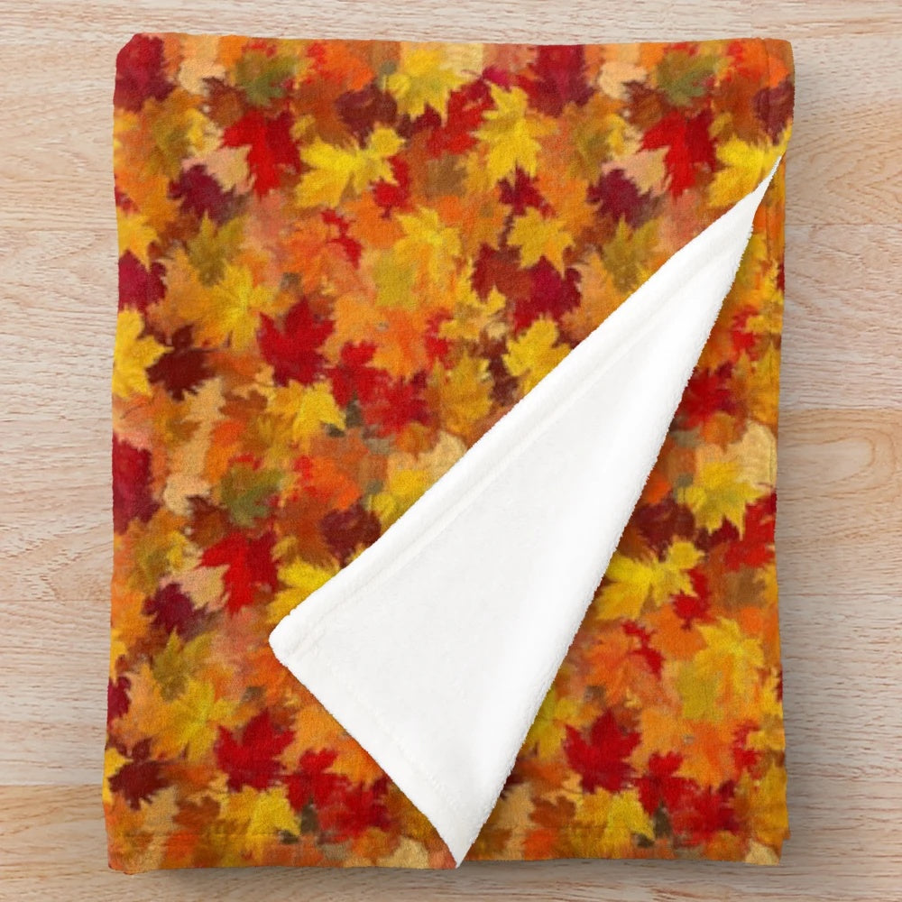 Vibrant fall leaves pattern plush blanket with a cozy, soft feel