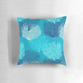 Decorative throw pillow featuring a vibrant fan coral print in turquoise, aqua, and cobalt blue shades.