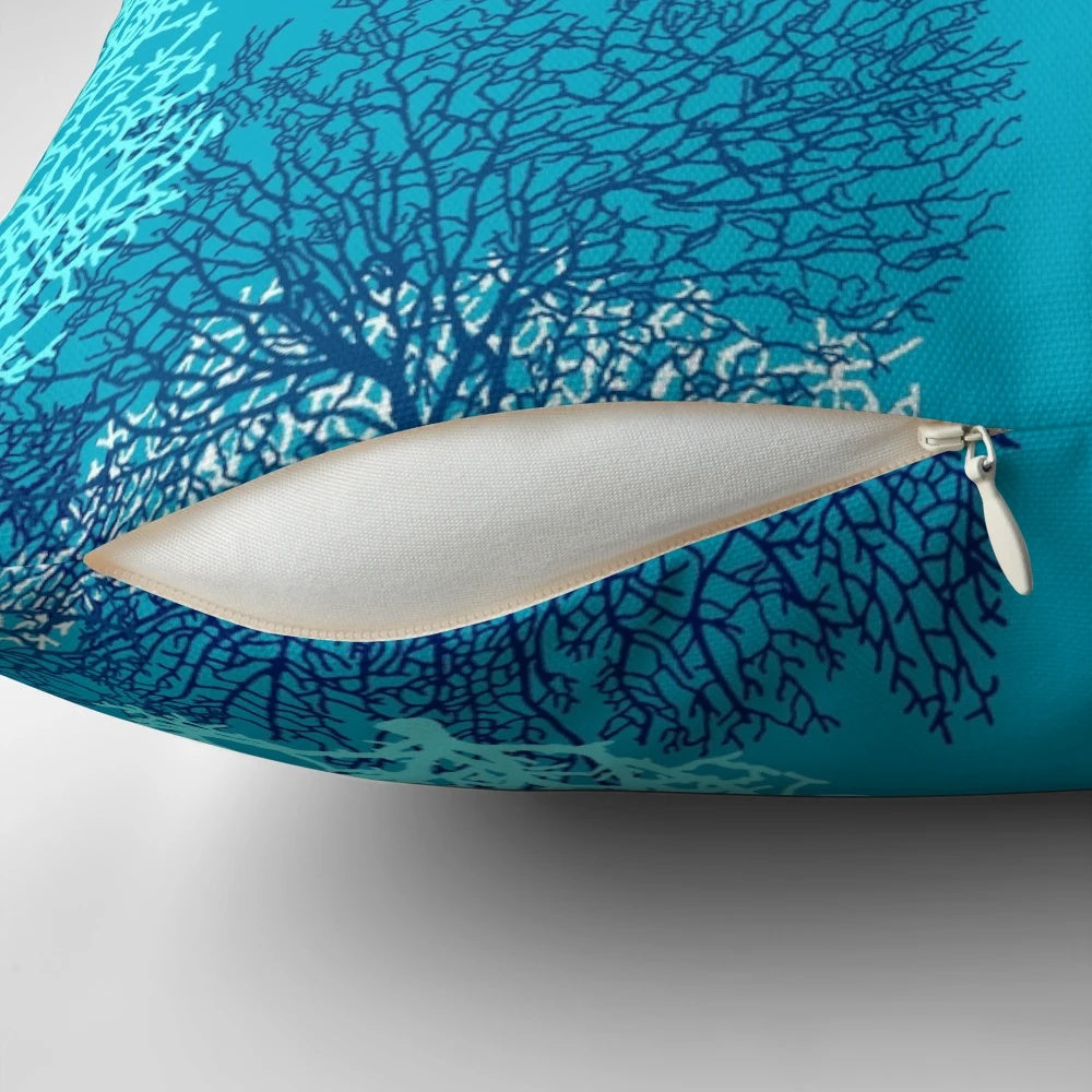 Decorative throw pillow featuring a vibrant fan coral print in turquoise, aqua, and cobalt blue shades.