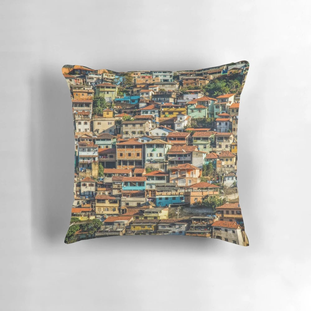 Colorful pillow featuring a vibrant favela scene from Brazil, showcasing the country's unique architecture and street style.