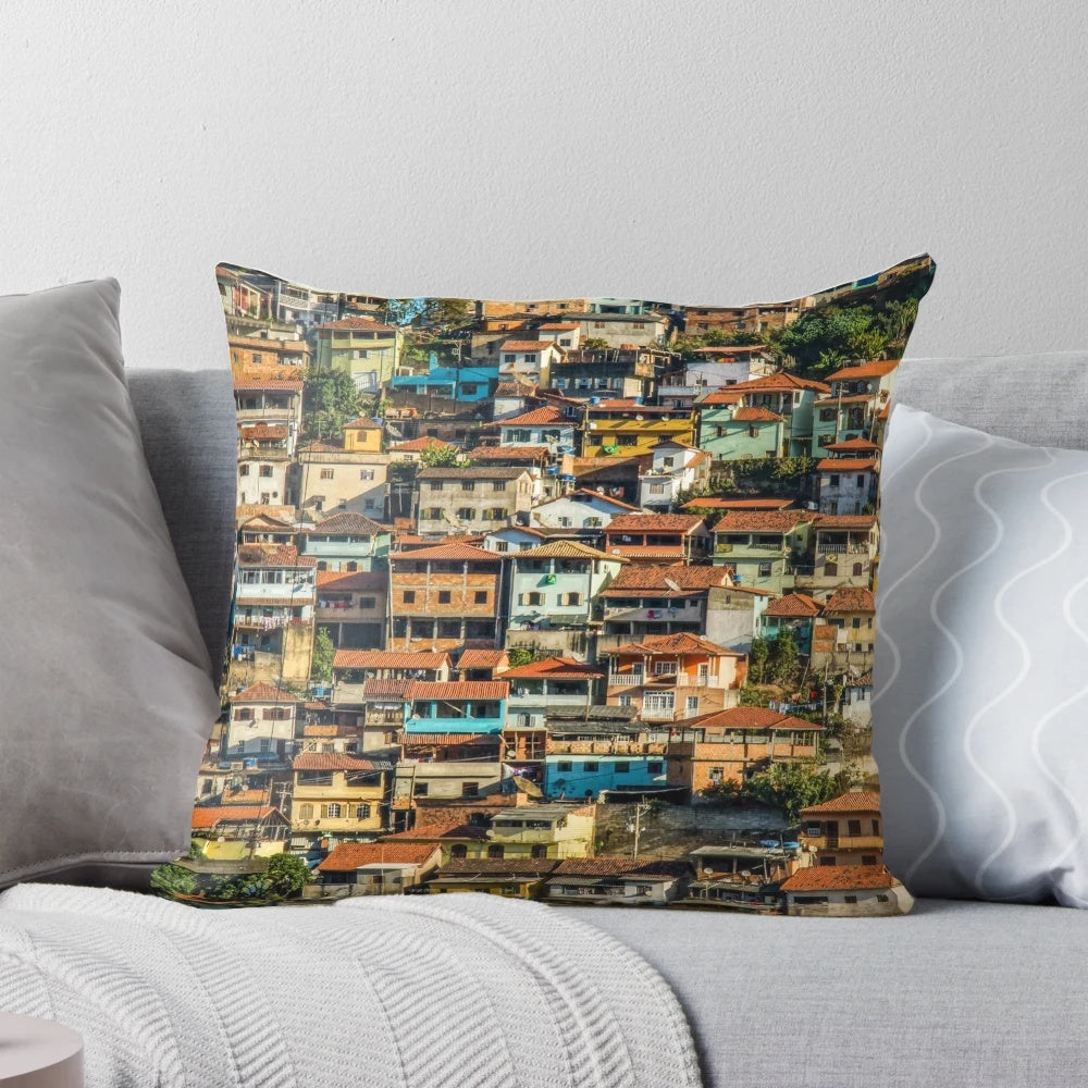 Colorful pillow featuring a vibrant favela scene from Brazil, showcasing the country's unique architecture and street style.