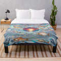 Colorful plush blanket featuring a sunset and fish design
