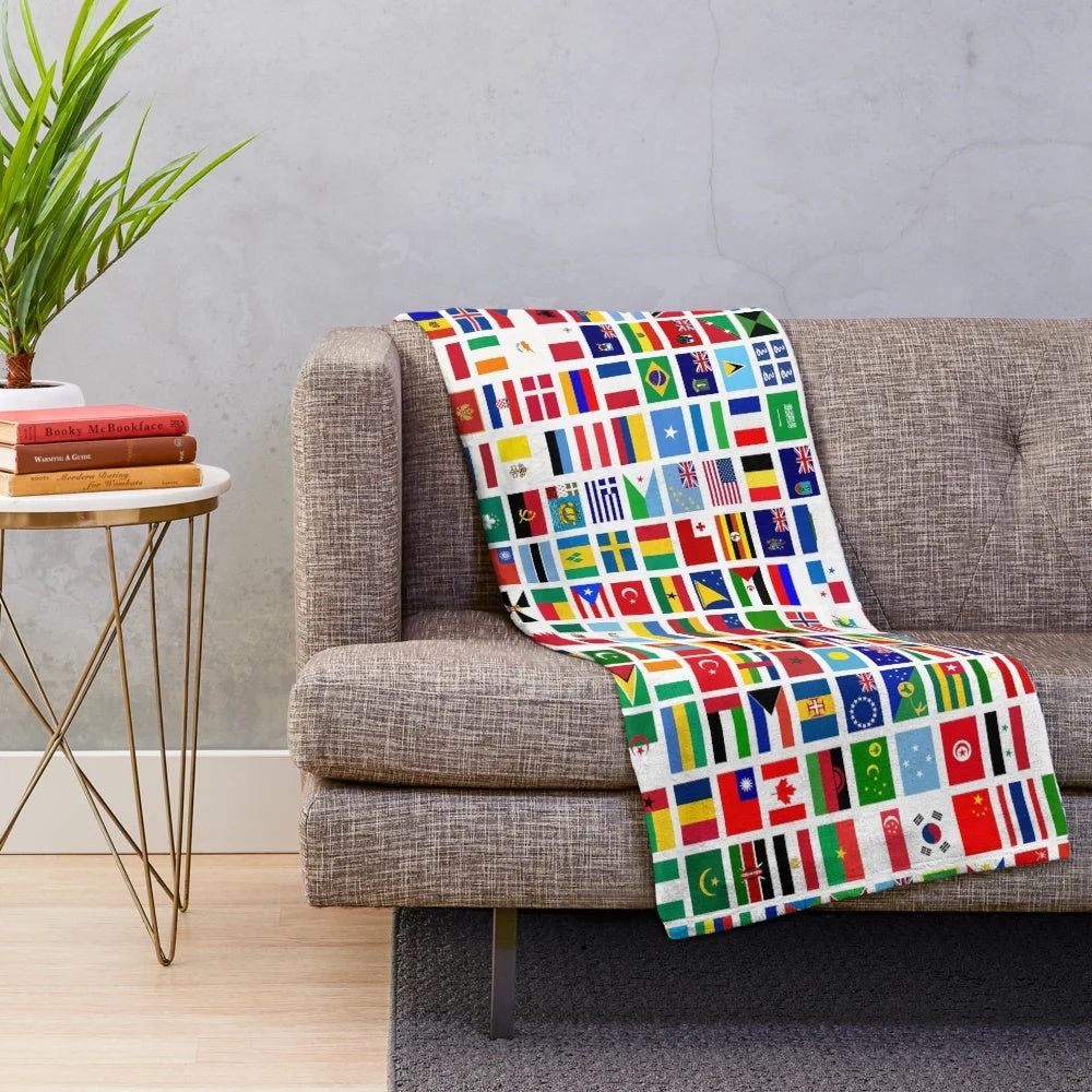 Colorful flags of the world printed on a soft plush blanket