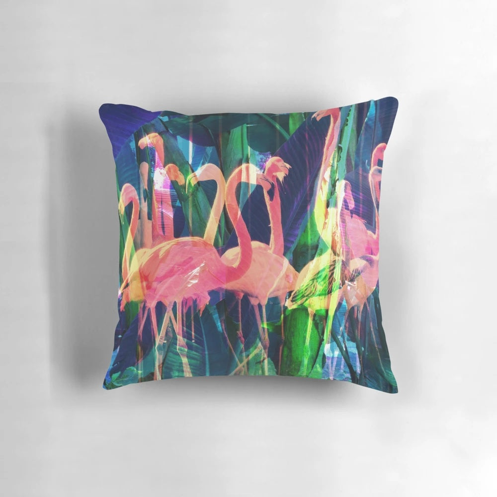 Colorful flamingo, floral, and tropical leaf design on a decorative throw pillow