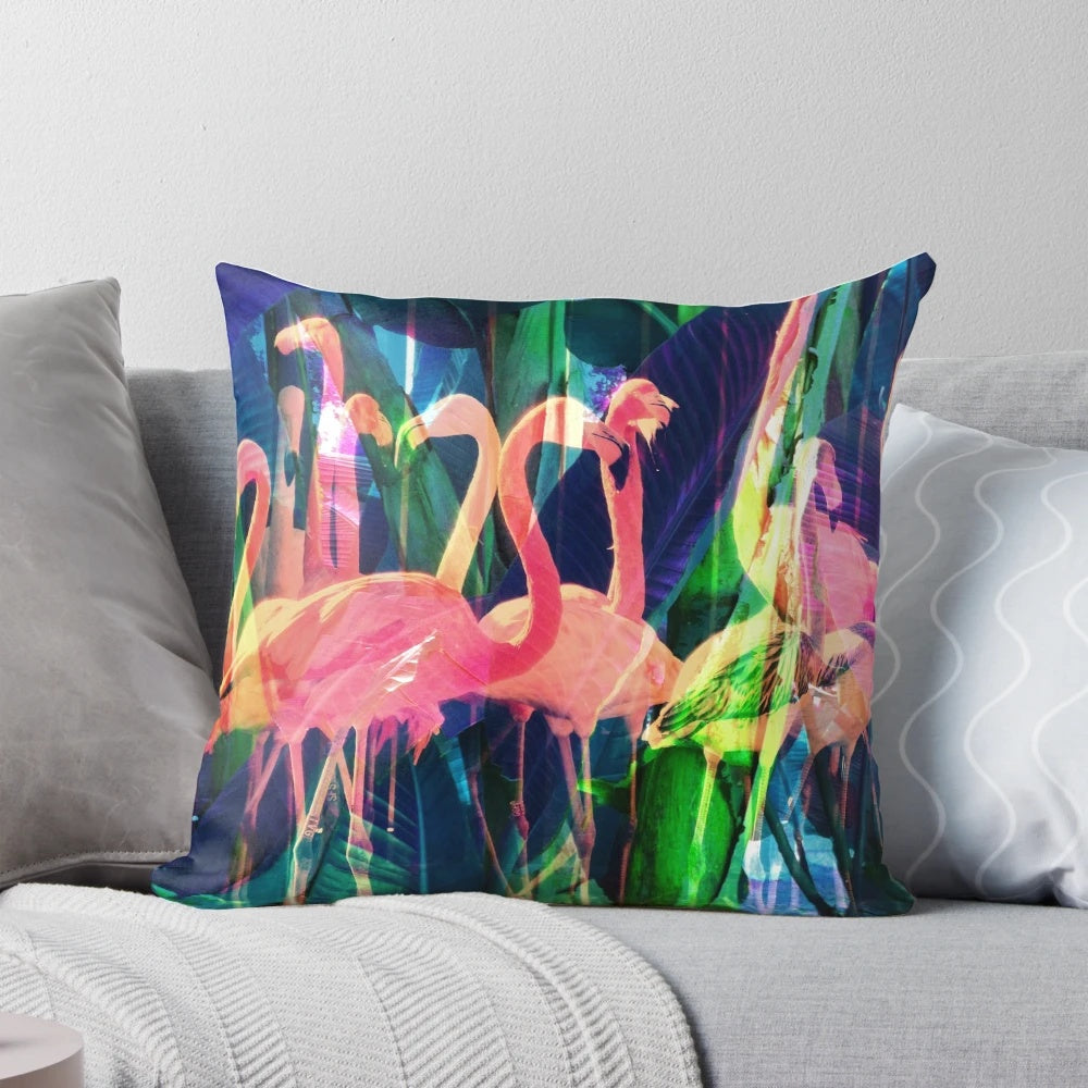 Colorful flamingo, floral, and tropical leaf design on a decorative throw pillow