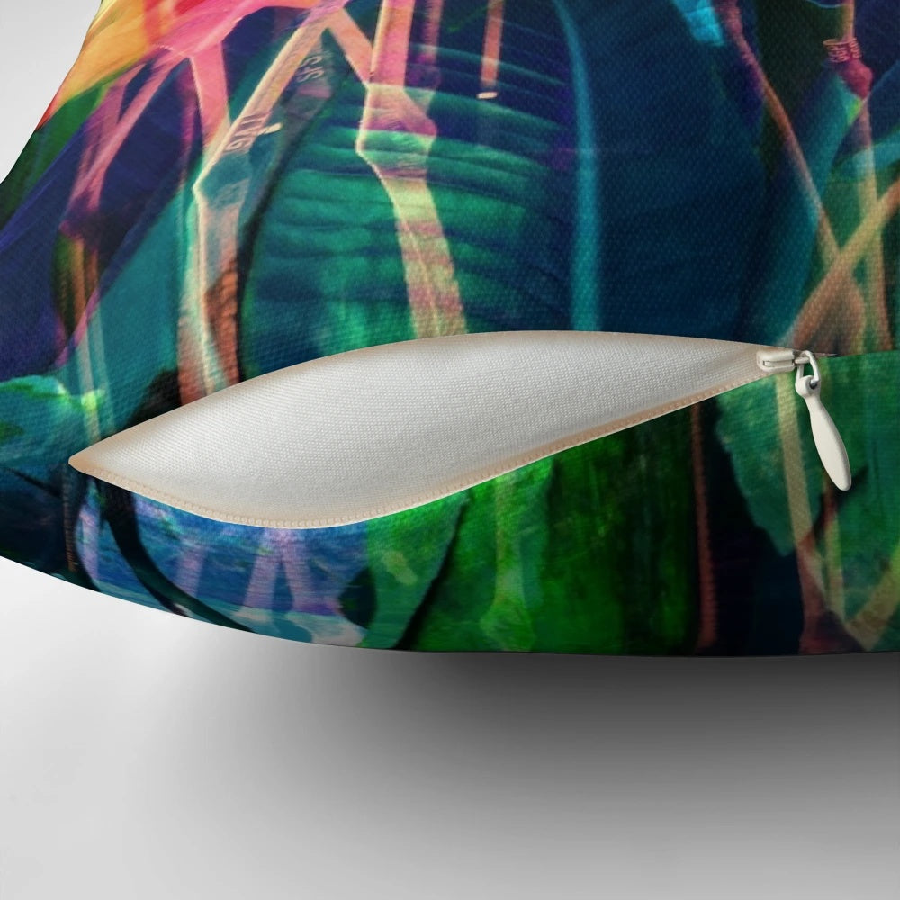 Colorful flamingo, floral, and tropical leaf design on a decorative throw pillow