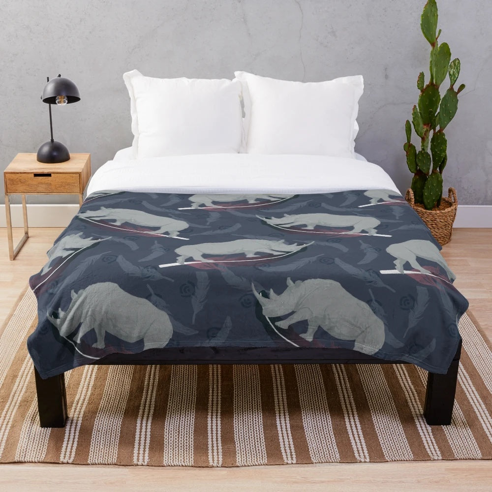 Colorful plush blanket with abstract floating white rhino design