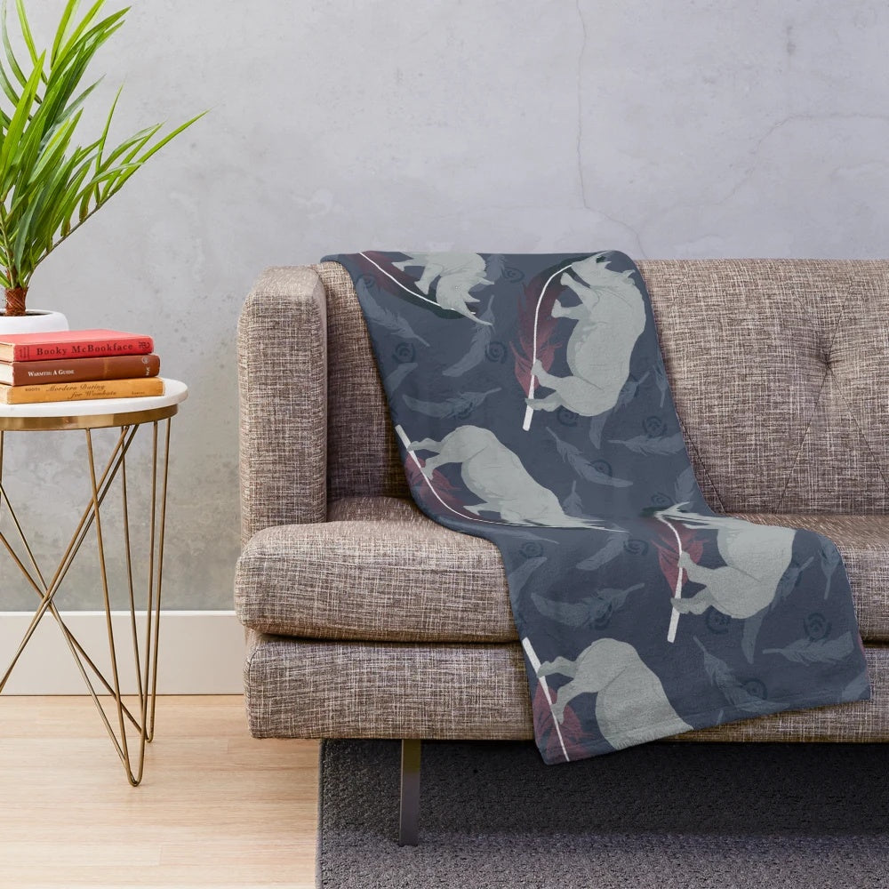 Colorful plush blanket with abstract floating white rhino design