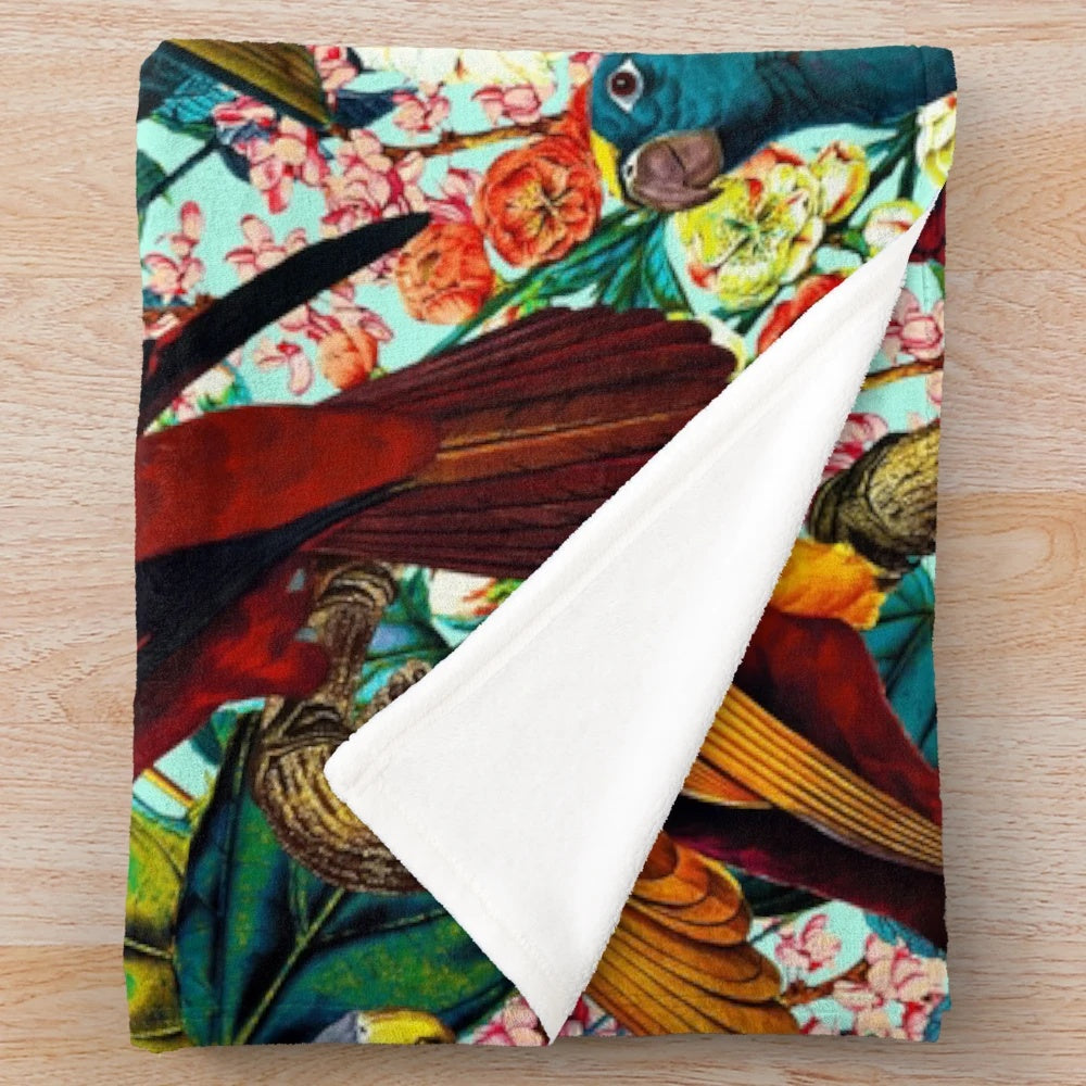 Plush blanket with a vibrant floral and bird pattern