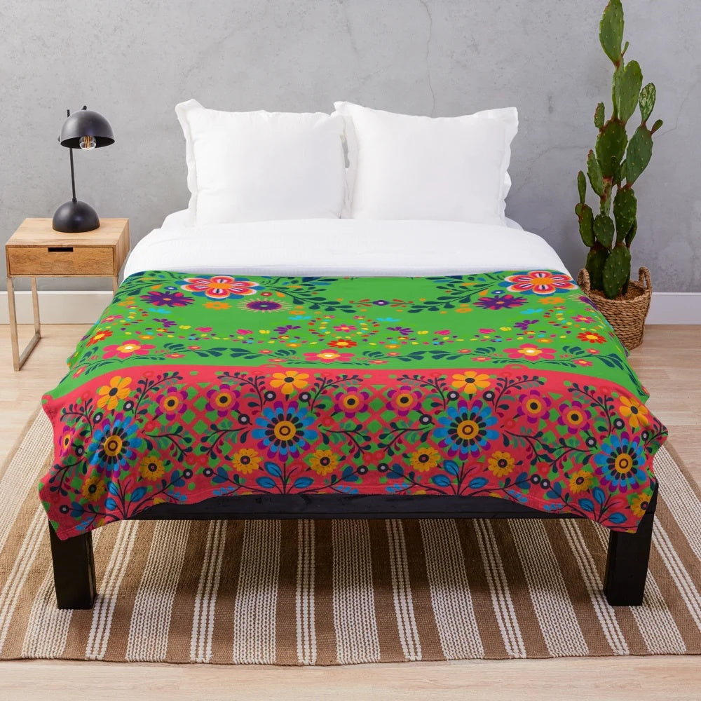 Colorful plush blanket with a botanical art print featuring traditional Indian cultural patterns