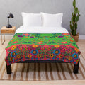 Colorful plush blanket with a botanical art print featuring traditional Indian cultural patterns