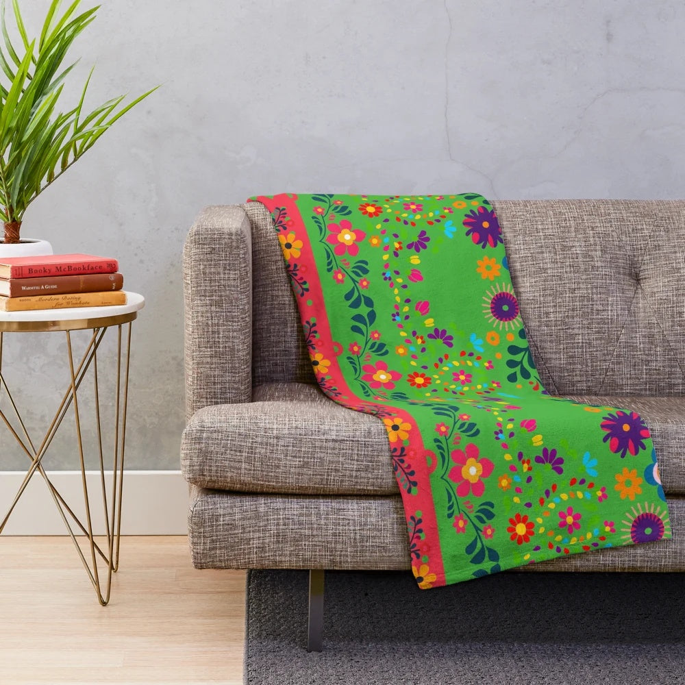 Colorful plush blanket with a botanical art print featuring traditional Indian cultural patterns