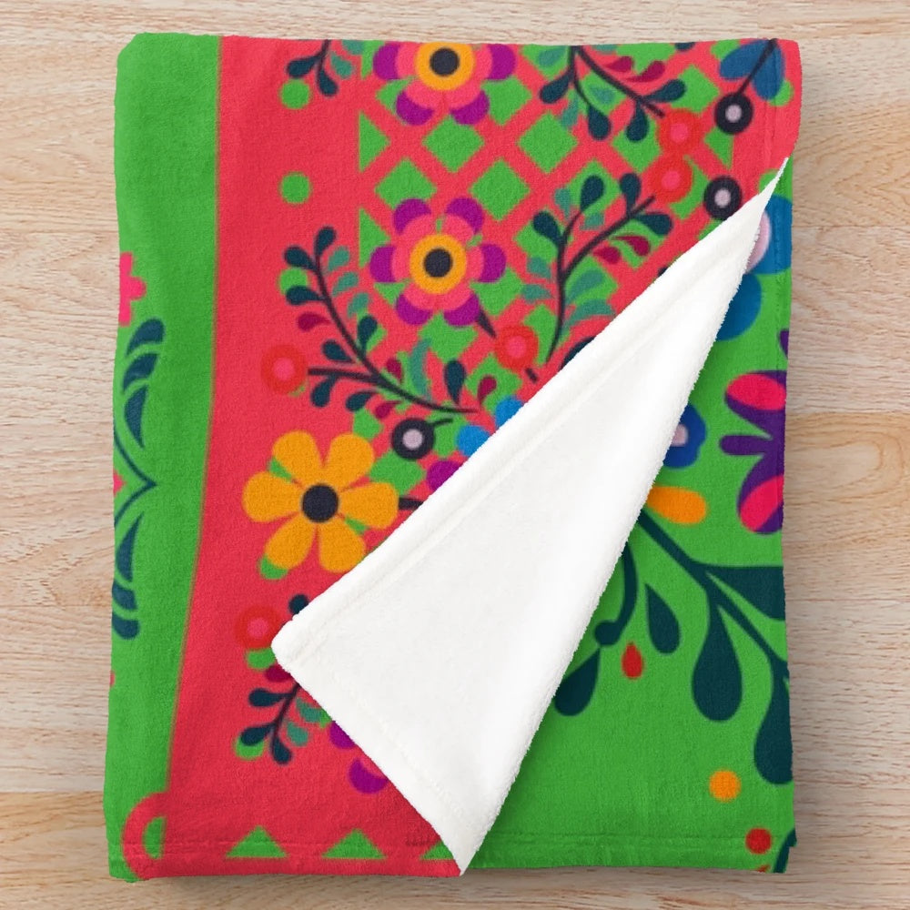 Colorful plush blanket with a botanical art print featuring traditional Indian cultural patterns