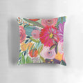 Colorful floral pillow featuring a lush bouquet of pink, purple and green flowers
