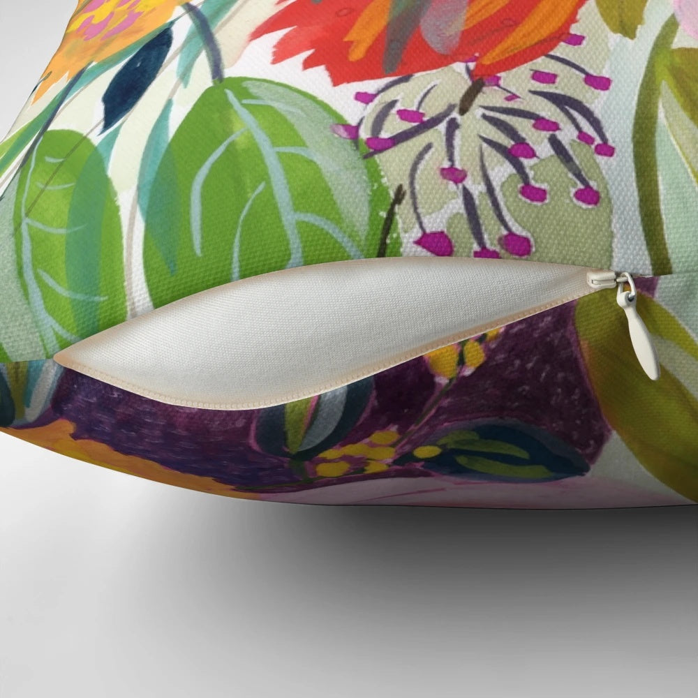 Colorful floral pillow featuring a lush bouquet of pink, purple and green flowers