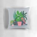 Decorative throw pillow featuring a bold, floral design with a playful black cat, perfect for cat lovers and home decor enthusiasts.