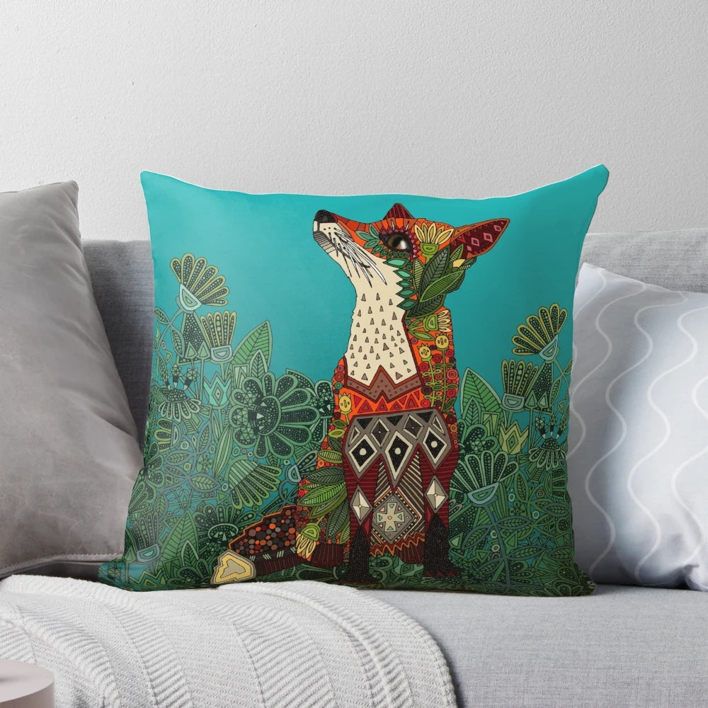 Colorful floral and fox motif decorative pillow with botanical and tribal patterns in teal, turquoise, and green