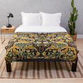 Plush blanket with a vibrant floral and owl pattern inspired by William Morris designs