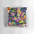 Closeup of a vibrant, colorful floral painting print on a throw pillow.