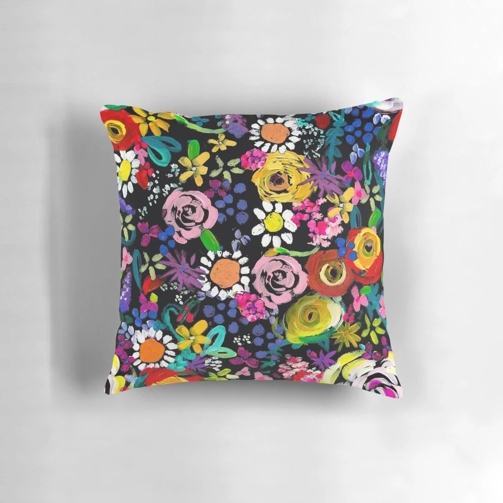 Closeup of a vibrant, colorful floral painting print on a throw pillow.