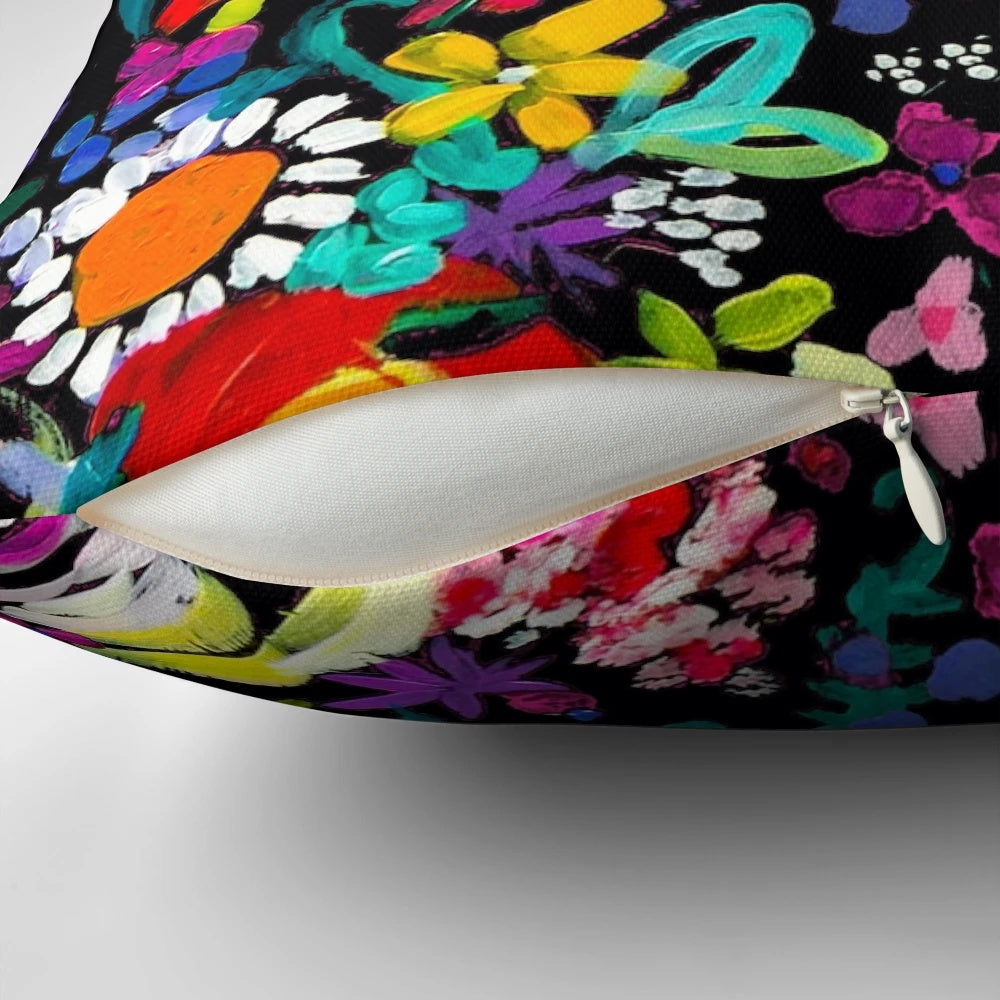Closeup of a vibrant, colorful floral painting print on a throw pillow.