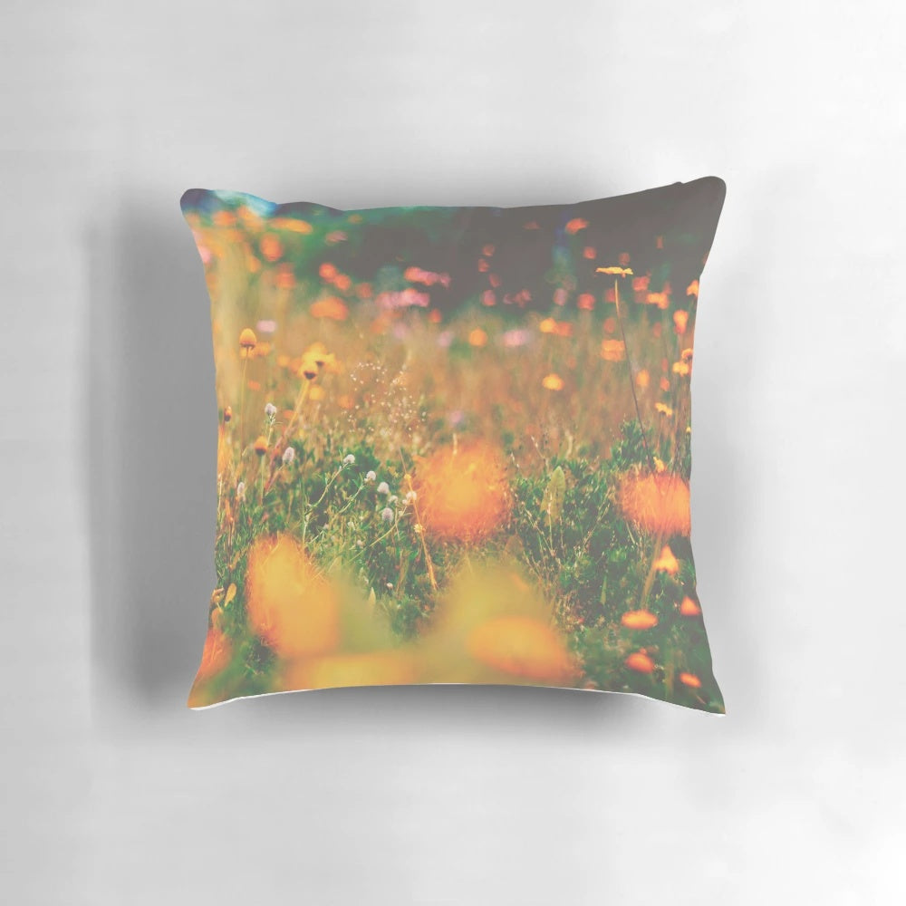 Colorful floral pillow featuring a vibrant array of summer flowers