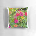 Colorful pillow featuring a bouquet of red, yellow, and pink flowers