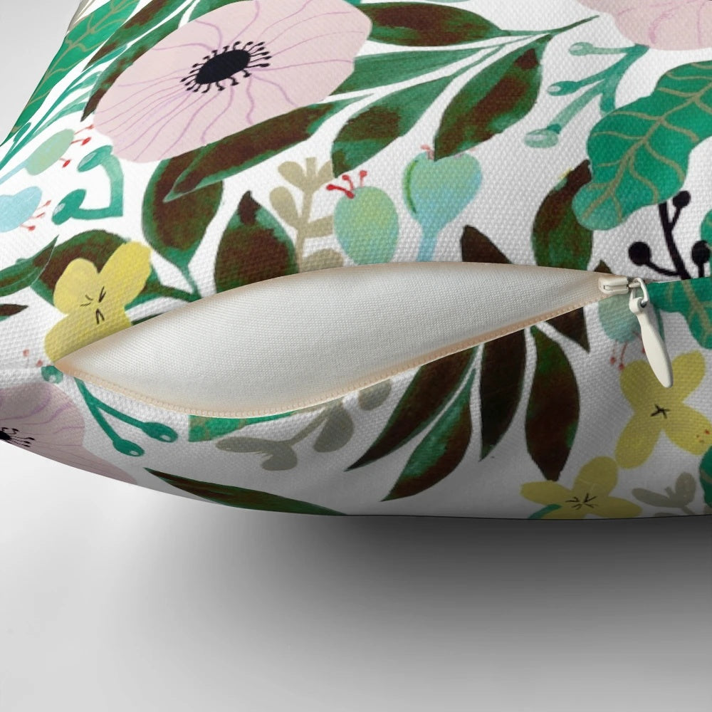 Unelmia 2 throw pillow featuring a vibrant floral pattern in a bohemian, tropical design.