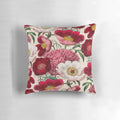 Colorful watercolor painting of a bouquet of pink, white, and red peonies and anemone flowers on a floral pillow.