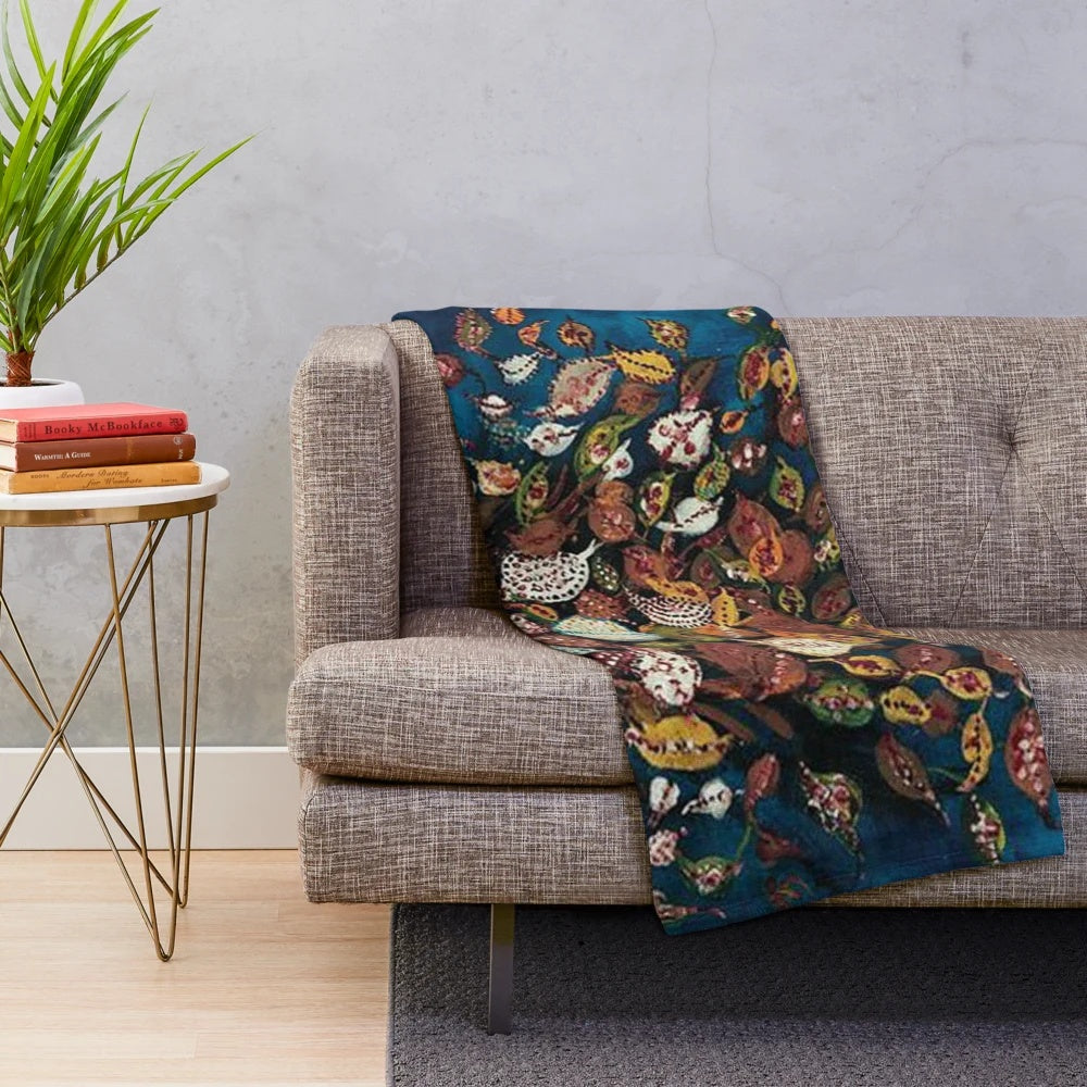 Plush blanket with a vibrant bouquet of leaves design inspired by the French artist Seraphine Louis