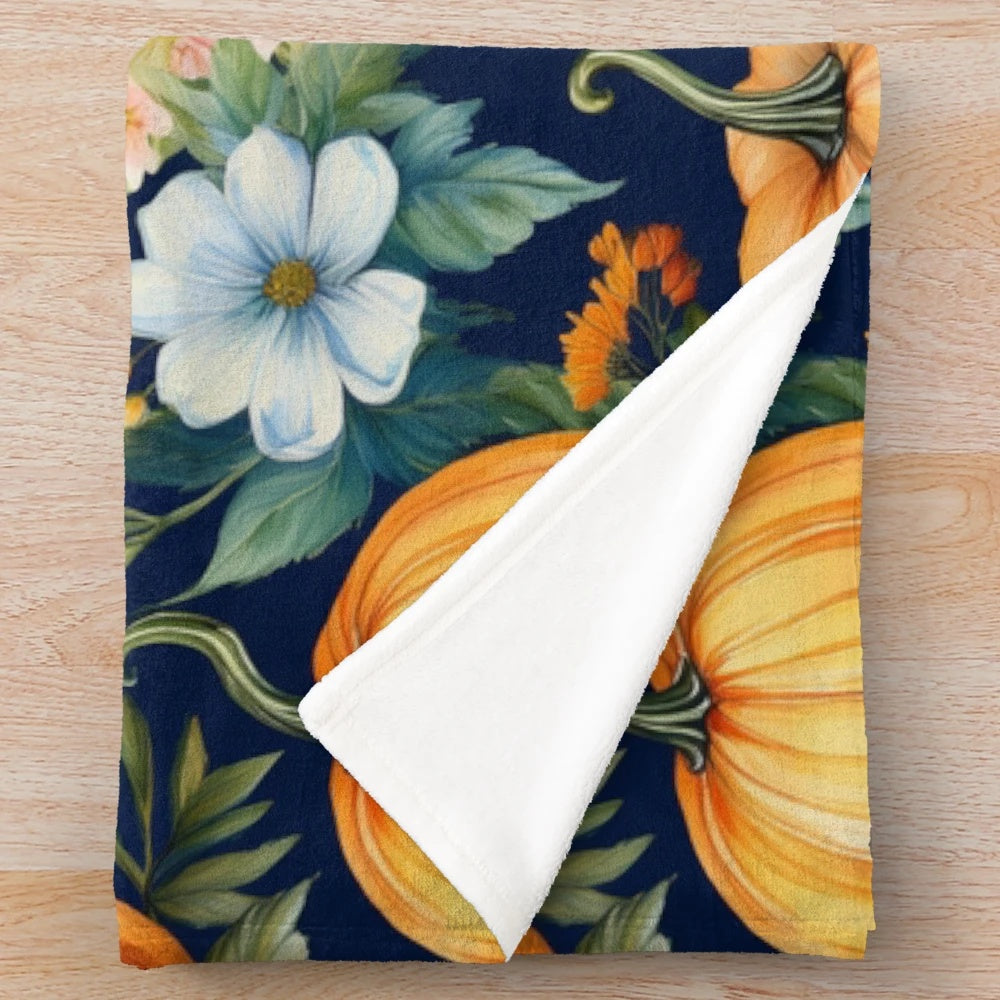 Pumpkin patch floral design on dark blue plush blanket