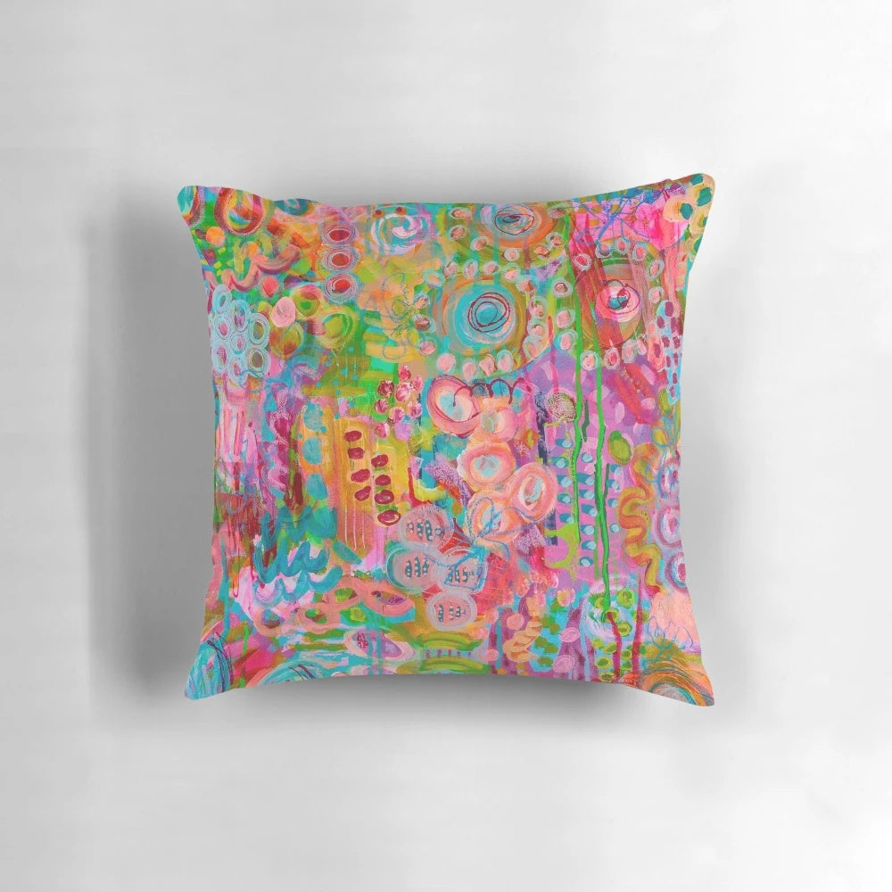 Colorful patterned throw pillow with floral design