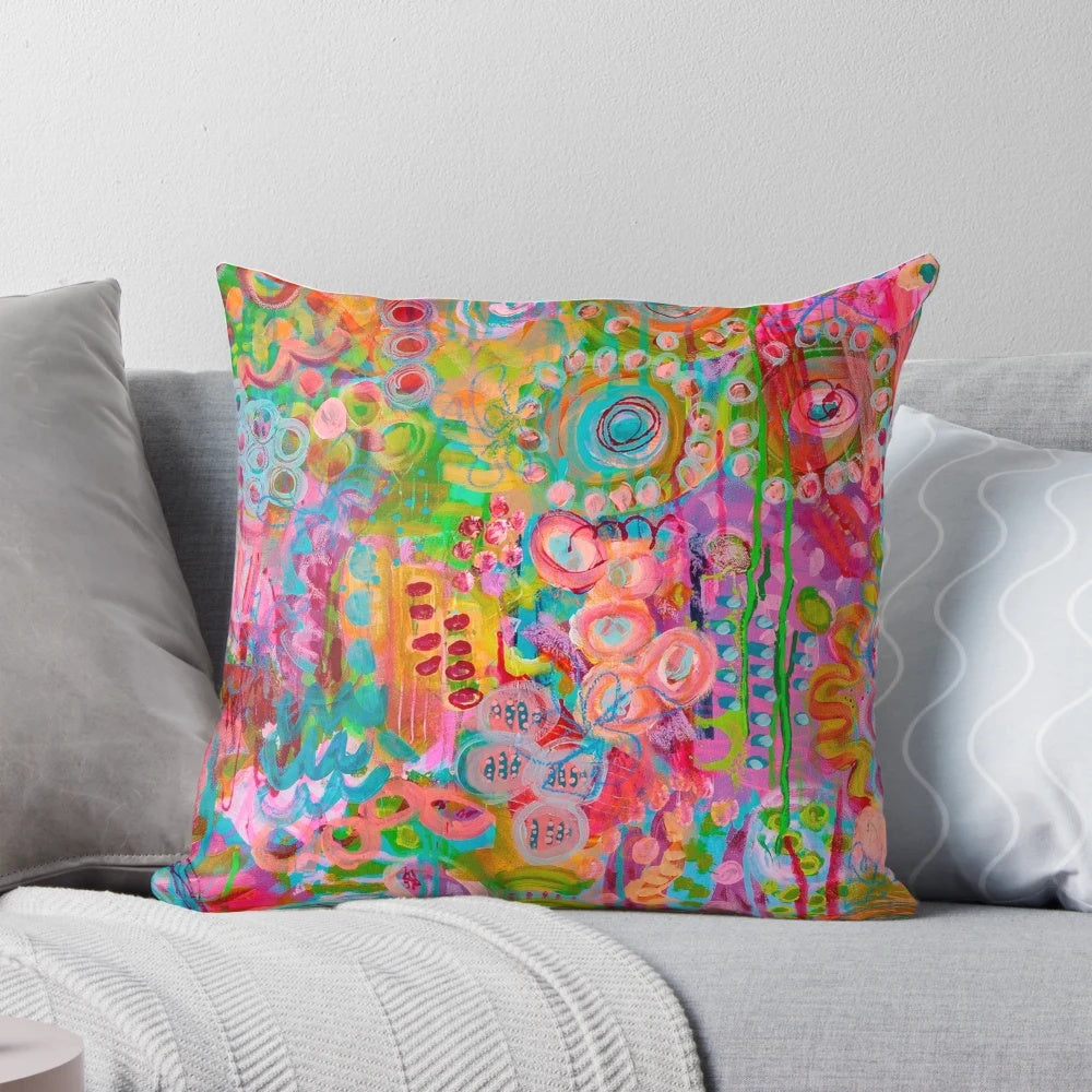 Colorful patterned throw pillow with floral design