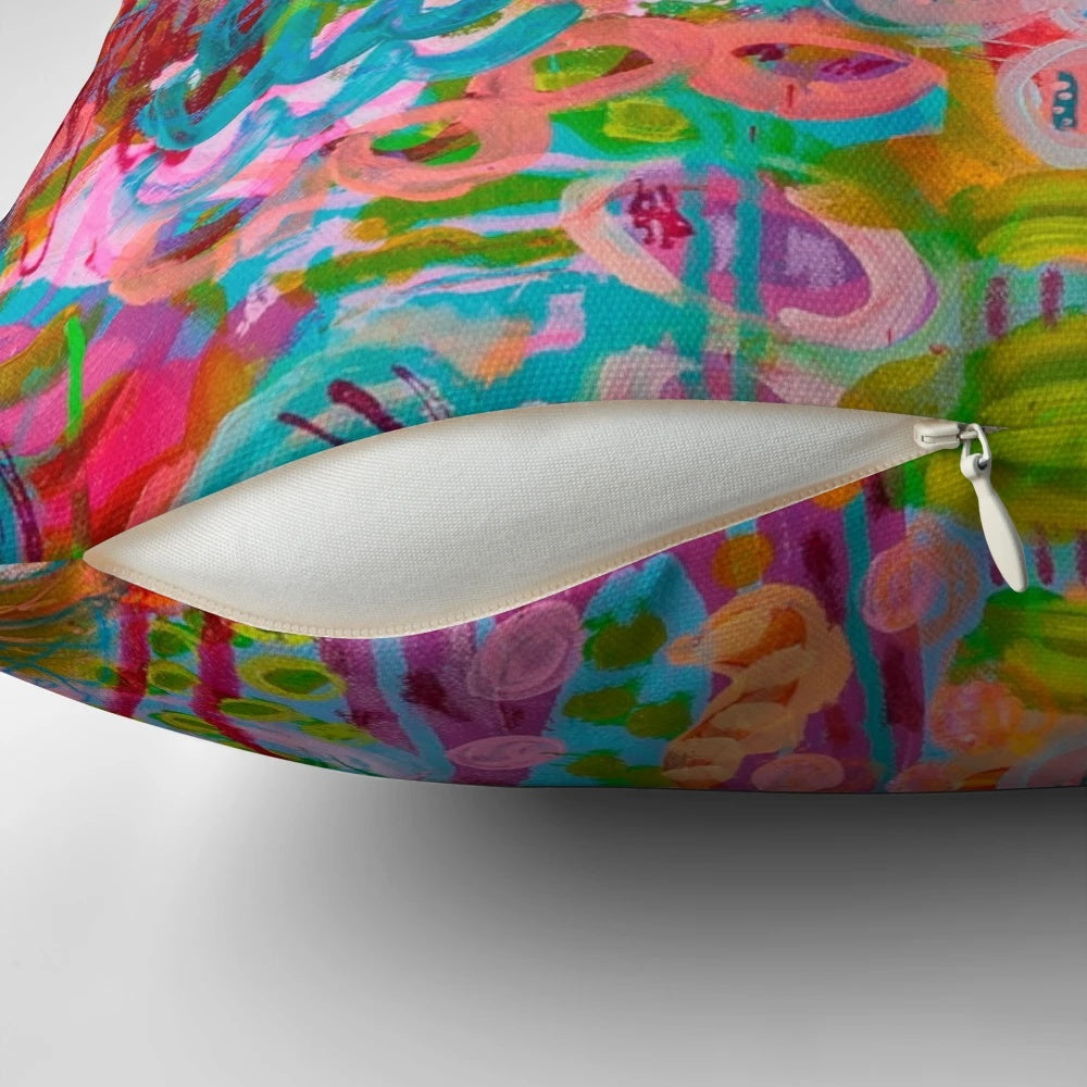 Colorful patterned throw pillow with floral design