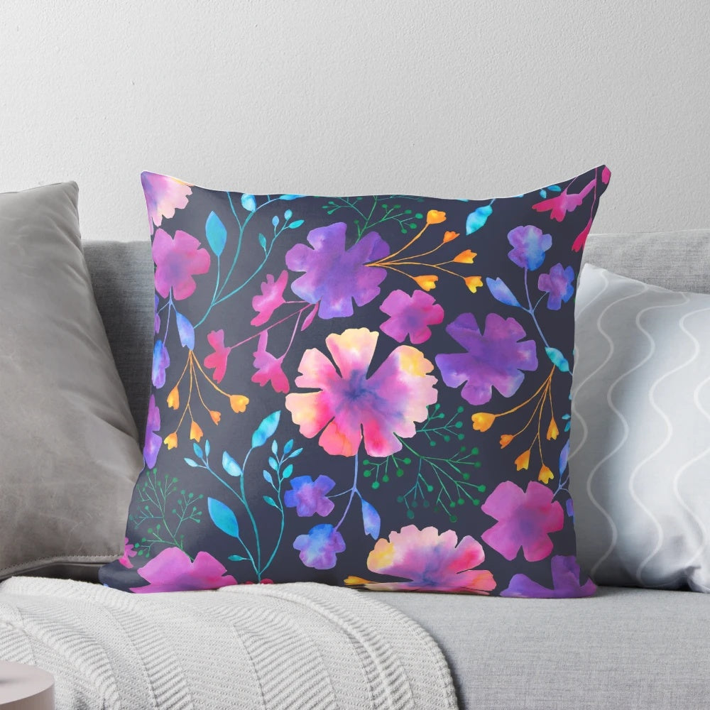 Colorful floral watercolor pattern on a decorative throw pillow