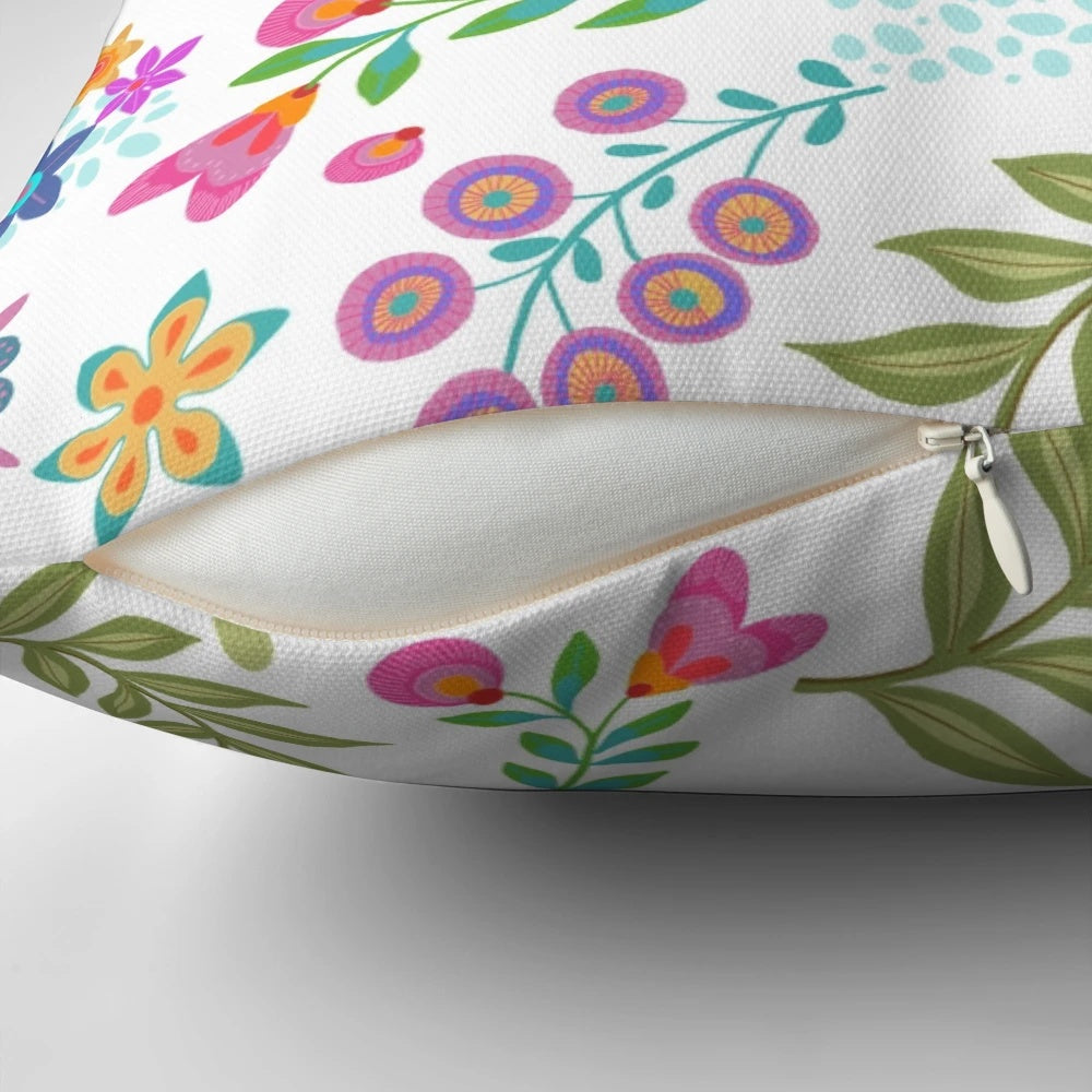 Colorful floral patterned pillow with turquoise, orange, and blue accents