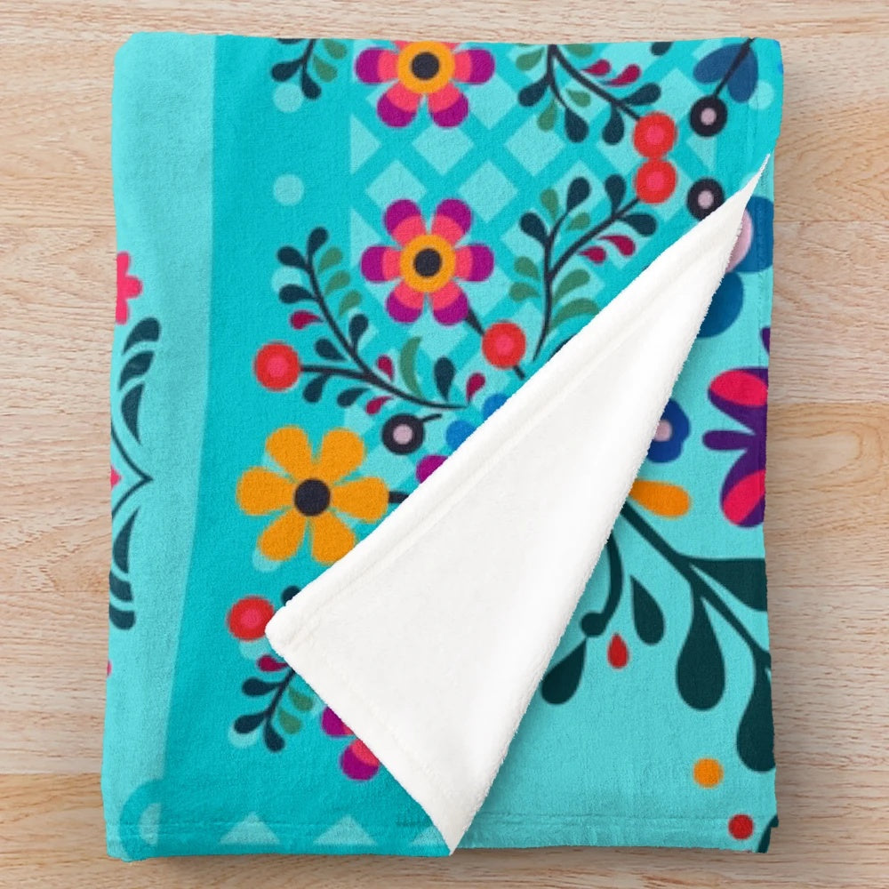 Colorful floral-patterned plush blanket representing Indian culture