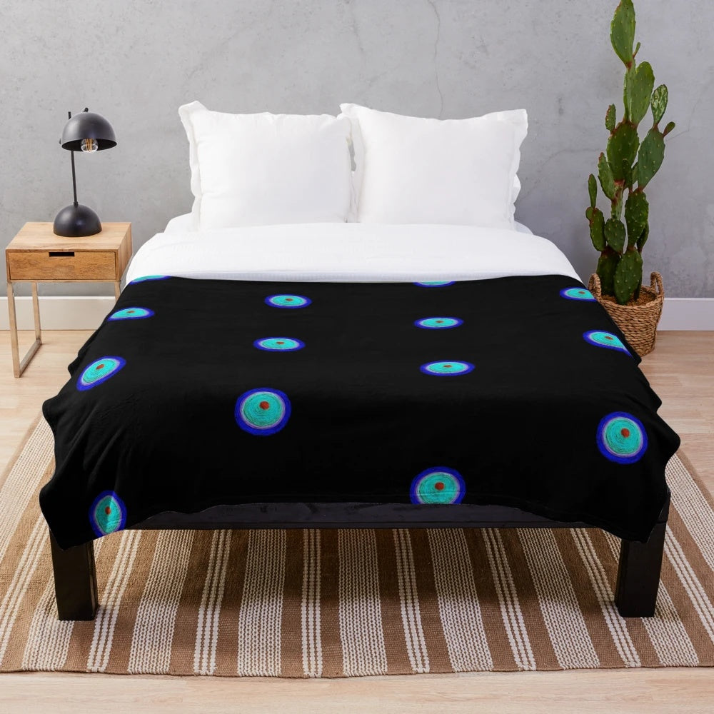 Fluorescent plush blanket with abstract geometric design and colorful patterns